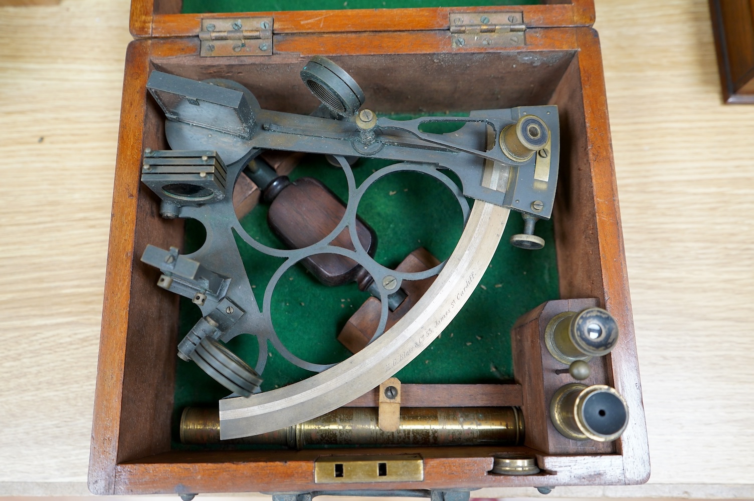 An early 20th century mahogany cased brass sextant by H.G. Blair & Co., 53 James St., Cardiff. Condition - fair to good, some general wear and tarnishing to the brass work. It would benefit from cleaning.